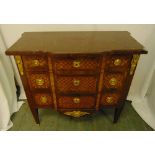 A French 19th century Louis XVI style chest of drawers with red marble top and gilded mounts on four