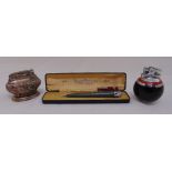 A Ronson pencil lighter in original case, an Art Deco Ronson ball lighter, and a Ronson Crown