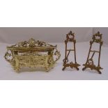 A pair of brass picture easels 23.5cm (h) and a gilded metal letter rack 20cm (h)