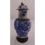 A Chinese blue and white crackle glazed baluster vase and cover decorated with birds and flowers,