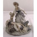 Lladro figural group of girl waking a sleeping shepherd on a shaped oval base with a lamb, marks