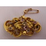 A Victorian yellow gold flower brooch set with semi-precious stones, gold tested 15ct, approx