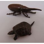 Two Japanese Meiji period bronze figurines a tortoise 6cm (l) and a beetle 8cm (l)