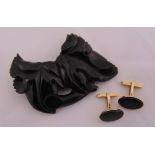 A pair of 9ct yellow gold and onyx cufflinks and a jet brooch of stylised leaf form