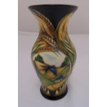 Moorcroft vase designed by Sian Lepper decorated with flowers and a landscape scene, marks to the