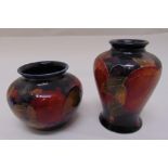 Two miniature Moorcroft vases decorated with flowers, marks to the bases, tallest 9cm (h)