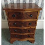 A rectangular fruit wood four drawer chest of drawers with bow front on four bracket feet, 72 x 48.5