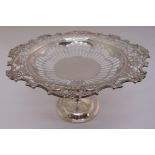 A Mappin and Webb silver fruit stand, scroll pierced with leaf and scroll border on faceted stem and