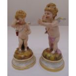 Two Meissen figurines of putti on raised circular bases, marks to the bases, tallest 21cm (h), one