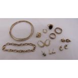 A quantity of 9ct gold jewellery to include bracelets, earrings and rings, approx total weight 28.