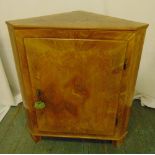 A continental inlaid fruitwood corner cabinet with hinged door on three bracket feet, 90 x 76.5 x