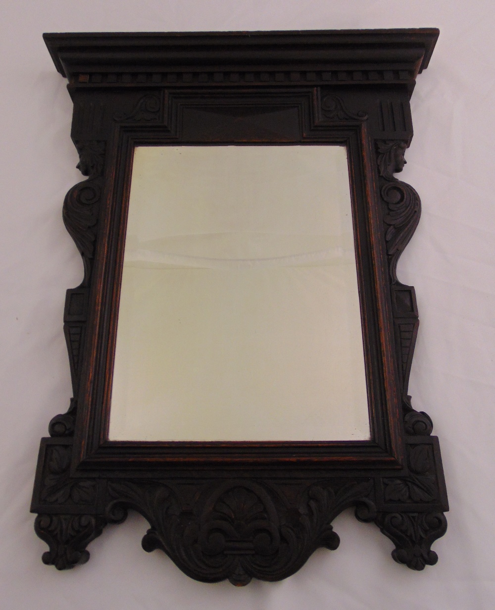 A carved shaped rectangular mahogany framed hall mirror, 72 x 57cm