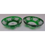 A pair of green circular cut glass Bohemian dishes on rim feet, 28cm diameter