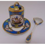 A Sevres style honey pot and cover with matching stand and spoon, decorated throughout with birds