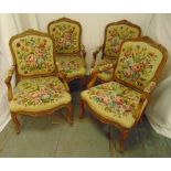 A set of four mahogany armchairs with upholstered tapestry backs and seats on cabriole legs