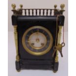 An architectural form mantle clock, two train movement, Roman numerals, to include key and pendulum,