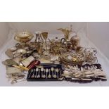 A quantity of silver plate to include a Middle Eastern coffee pot, cake stands, a teapot and cased
