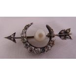 A Victorian crescent brooch set with old cut diamonds and a cultured pearl