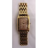 Saint Honore Paris gold plated ladies wristwatch with rectangular pink dial, Arabic numerals,