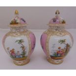 A pair of Dresden baluster vases and covers decorated with courting scenes and flowers (one cover