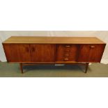 G-Plan 1970s rectangular teak sideboard with drawers and cupboards on four tapering turned supports,