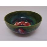 Moorcroft green ground bowl decorated with flowers, marks to the base, 16cm diameter