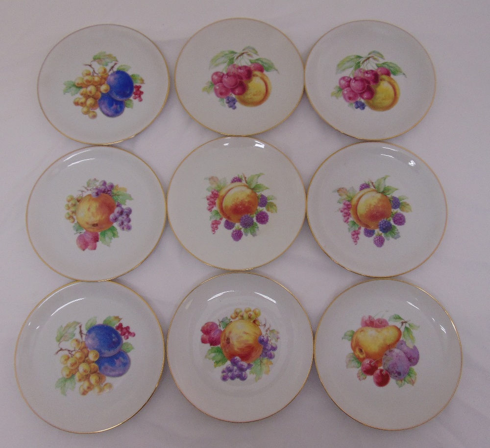 Nine KPM fruit plates, marks to the bases, 21.5cm diameter