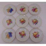 Nine KPM fruit plates, marks to the bases, 21.5cm diameter