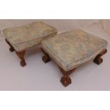 A pair of rectangular foot stools on ball and claw feet, 21 x 42 x 31cm