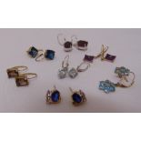 Seven pairs of 9ct gold earrings set with various coloured stones, approx total weight 19.3g