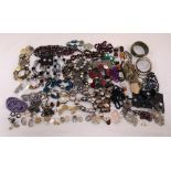 A quantity of costume jewellery to include necklaces, bracelets, earrings, rings and brooches