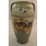 A Japanese decorative two handled vase decorated with birds, shells in a lattice weave base, marks