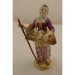 Meissen figurine Cries of Paris of a lady holding a baby in a cradle, marks to the base, restoration