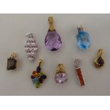 Eight 9ct gold pendants set with various coloured stones, approx total weight 23.1g
