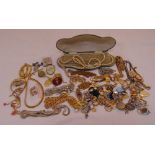 A quantity of costume jewellery to include necklaces, brooches, bracelets and earrings