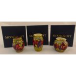 Moorcroft enamel miniatures to include three vases decorated with fruits and flowers, one with