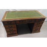 A reproduction mahogany pedestal desk with tooled leather top, brass handles, 76.5 x 137.5 x 69cm