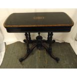 A Victorian ebonised games table on four outswept legs, 73 x 92 x 45cm