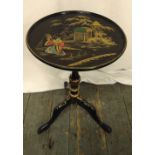 An English 1920s Chinoiserie lacquered circular wine table on three outswept legs, 50cm (h) 30cm (