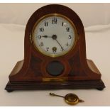 An early 20th century mahogany mantle clock, white enamel dial, Arabic numerals, to include