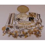 A quantity of costume jewellery to include necklaces, brooches, bracelets, cufflinks and earrings