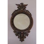 A 19th century style cast metal wall mirror, 50 x 28.5cm