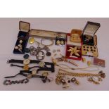A quantity of costume jewellery to include brooches, pendants, watches and necklaces