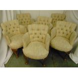 A set of six upholstered occasional chairs on cabriole legs