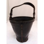 A Victorian leather fire bucket with swing handle, 25cm (h) 25cm (d)