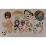 Nineteen decorative wall masks of various shape and style