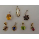 Seven 9ct gold pendants set with various coloured stones, approx total weight 20.1g