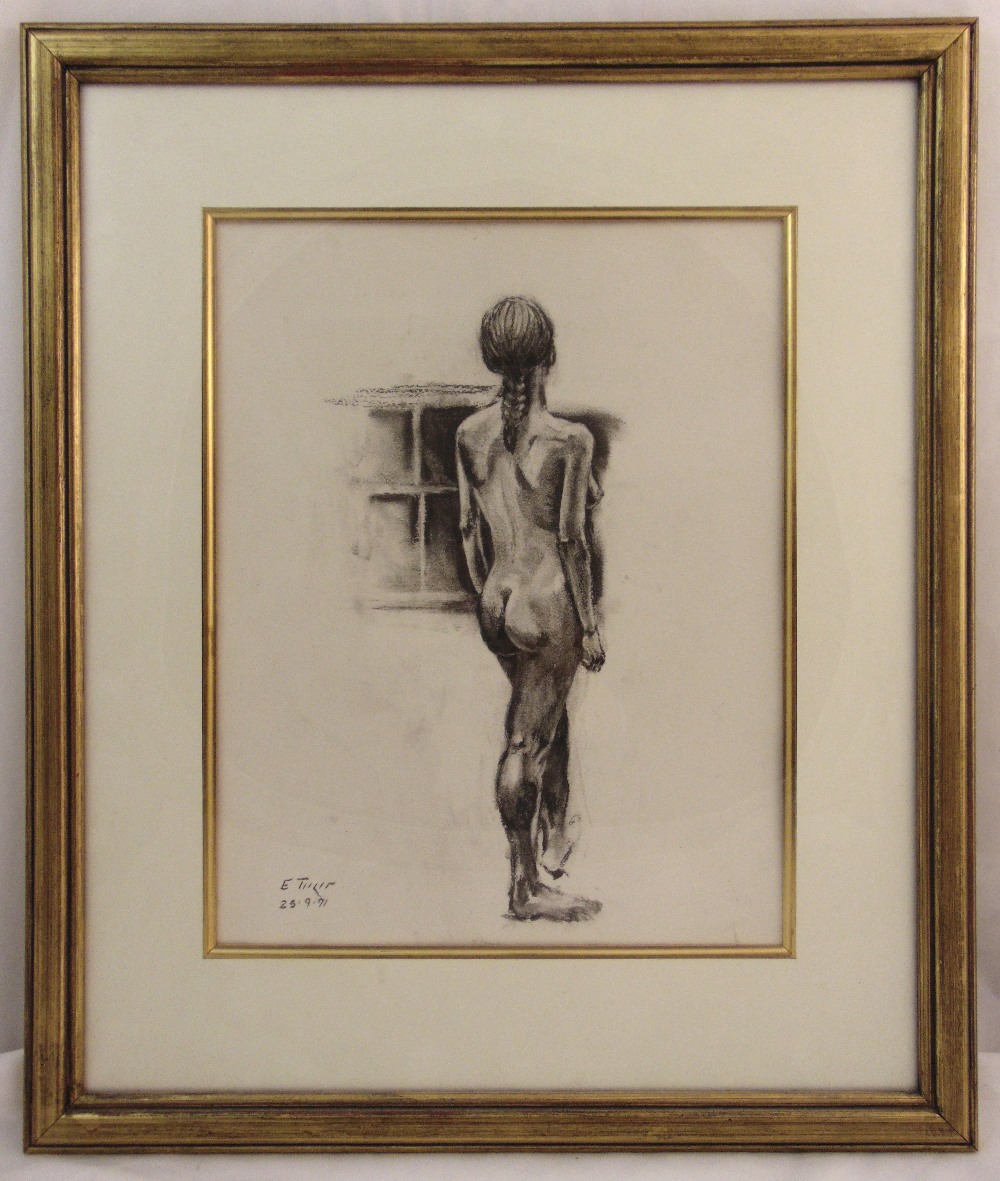 A framed and glazed charcoal drawing of a female figure, indistinctly signed bottom left, 36.5 x