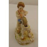 Meissen figurine of a putti sharpening his arrow, marks to the base, 11.5cm (h)