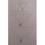 A quantity of 9ct gold jewellery to include two necklaces with pendants and a bracelet with a